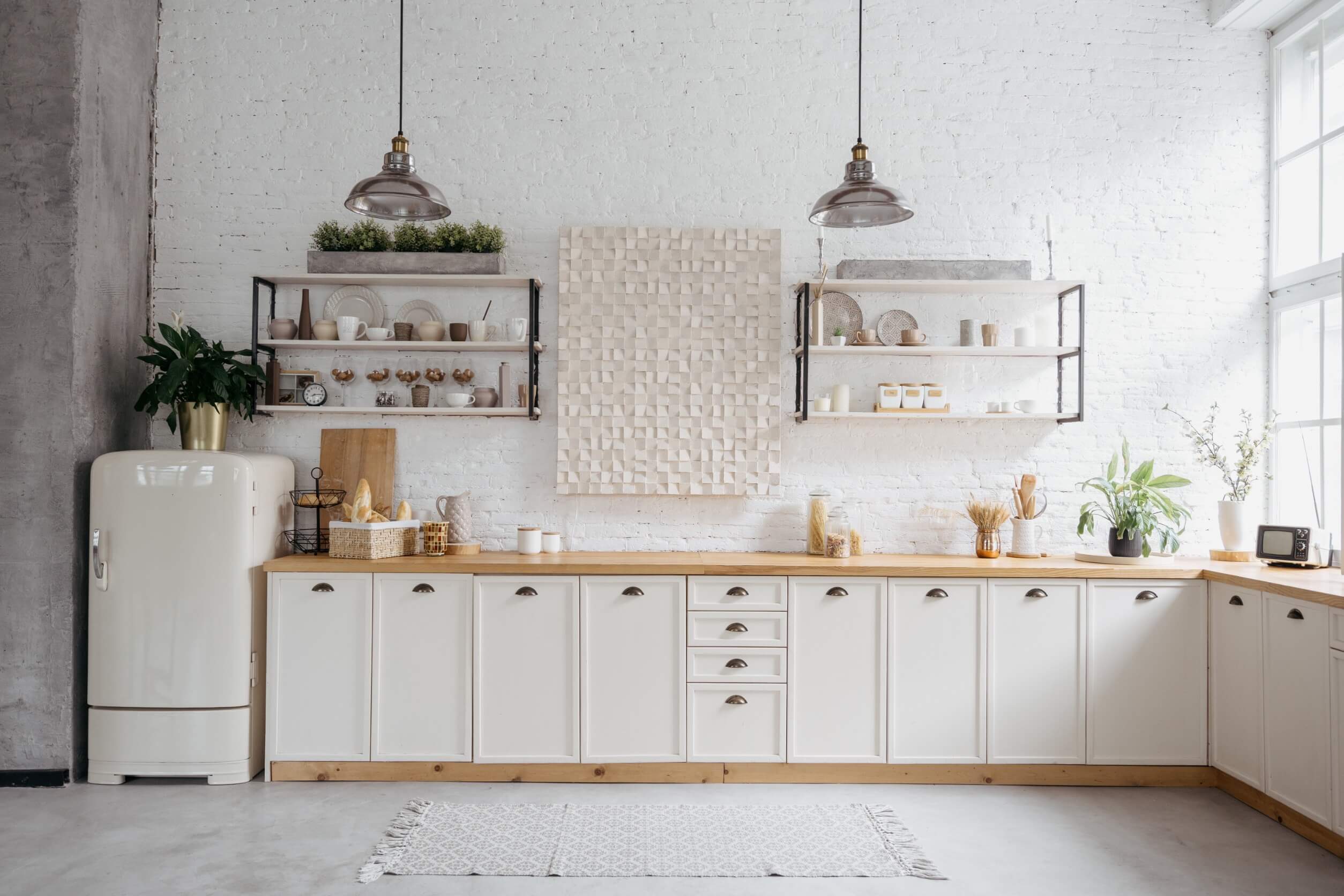 Updated rustic kitchen interior with white brick wall.