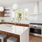 a kitchen with white quartz worktop